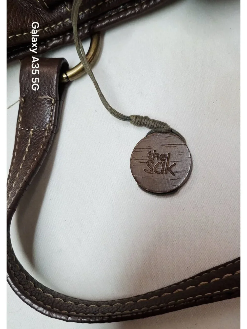 The Sak Brown Pebbled Leather Shoulder Bag With Printed Fabric Lining & Brass Ha